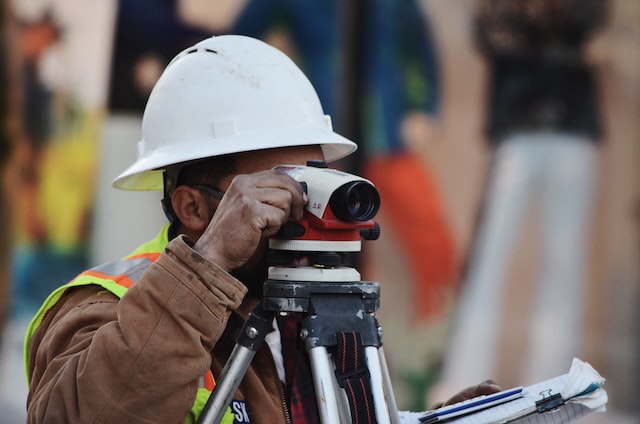 Constructor looking into tripod camera